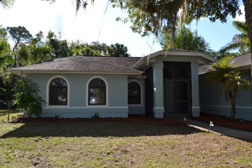 4314 Concert Street Port Charlotte, FL 33948 - Photo 3 of 27 a front view of a house