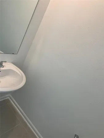 a bathroom with a sink and vanity
