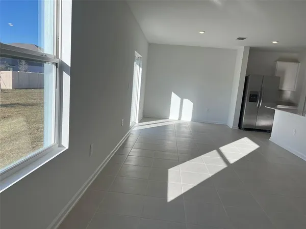 a view of a living room with a large window