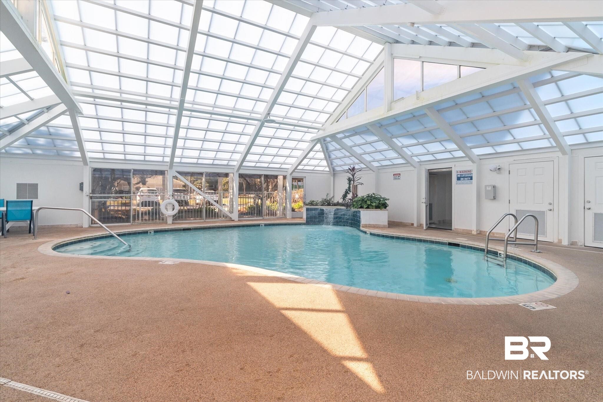 27770 Canal Road, Unit 2304 Orange Beach, AL 36561 - Photo 19 of 30 Community pool featuring a lanai, a patio, and a pergola