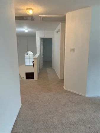 a view of a bathroom with a sink and mirror