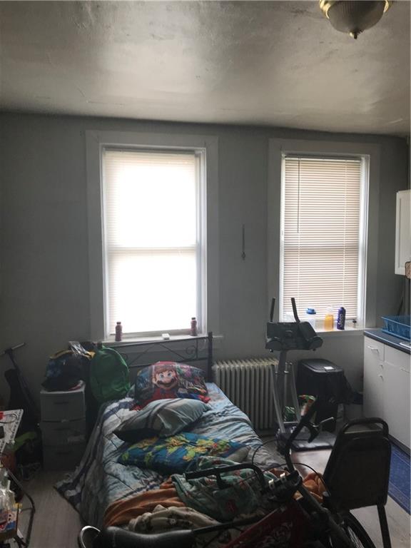 317 Hamilton Street McKees Rocks, PA 15136 - Photo 10 of 38 a bed sitting in a bedroom next to a window