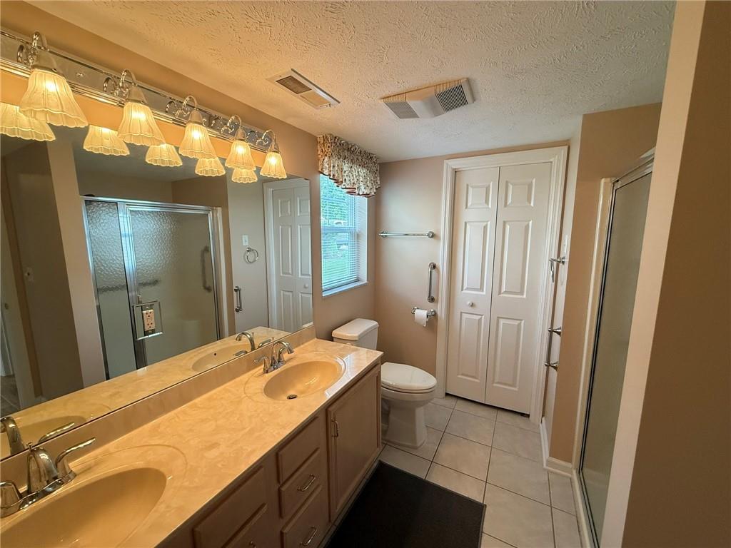 411 Chestnut Lane Apollo, PA 15613 - Photo 11 of 38 a bathroom with a sink and mirror with toilet