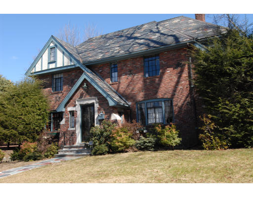 30 Sunset Road Newton, MA 02458 - Photo 1 of 26 a front view of a house with a yard