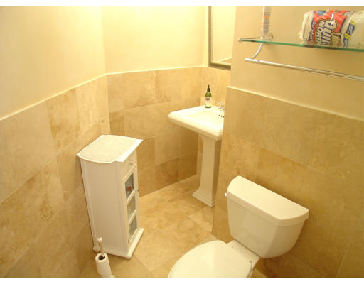 30 Sunset Road Newton, MA 02458 - Photo 14 of 26 a bathroom with a sink and a toilet