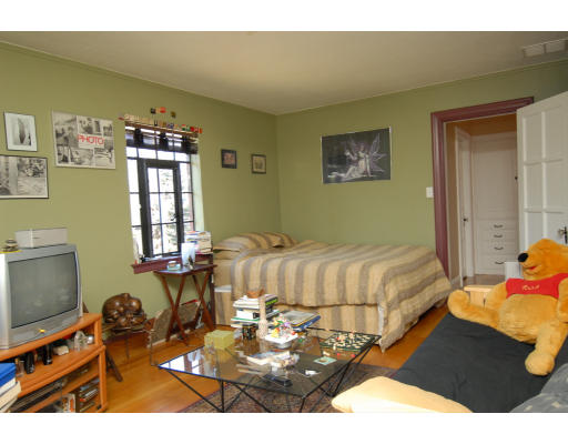 30 Sunset Road Newton, MA 02458 - Photo 18 of 26 a bedroom with a bed and furniture