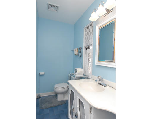 30 Sunset Road Newton, MA 02458 - Photo 19 of 26 a bathroom with a sink and a mirror