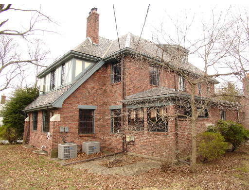 30 Sunset Road Newton, MA 02458 - Photo 23 of 26 a front view of a house with garden