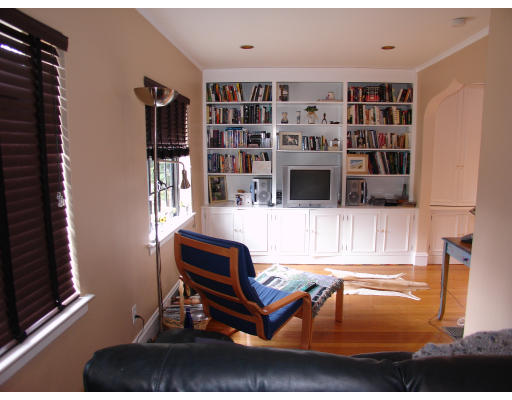30 Sunset Road Newton, MA 02458 - Photo 6 of 26 a living room with furniture a flat screen tv and a fireplace