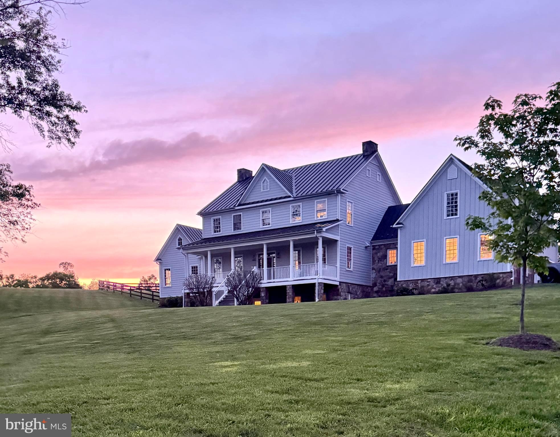 a front view of a house with a garden and deck