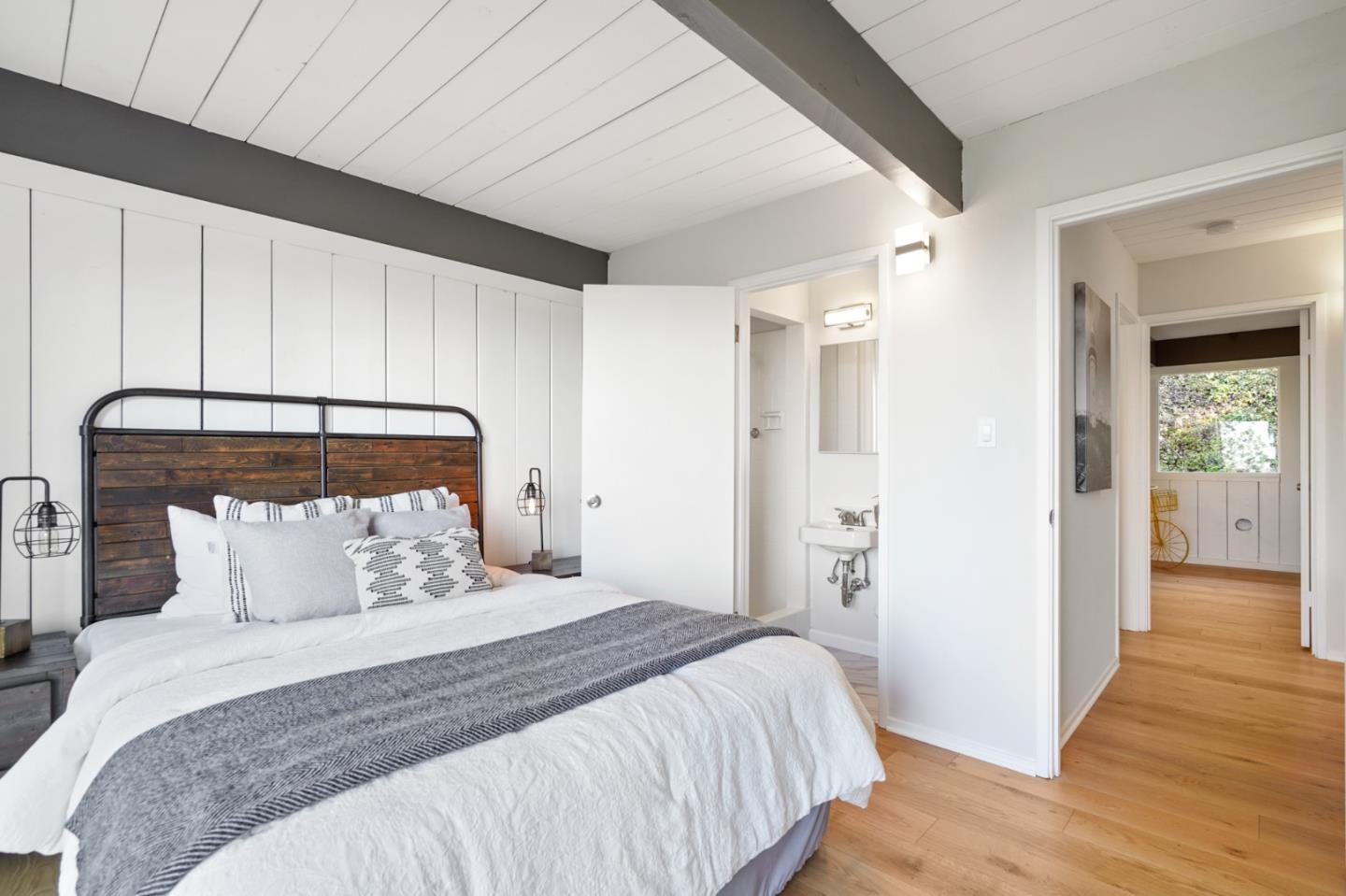 1384 Summit Road Berkeley, CA 94708 - Photo 23 of 31 a bedroom with a bed and wooden floor