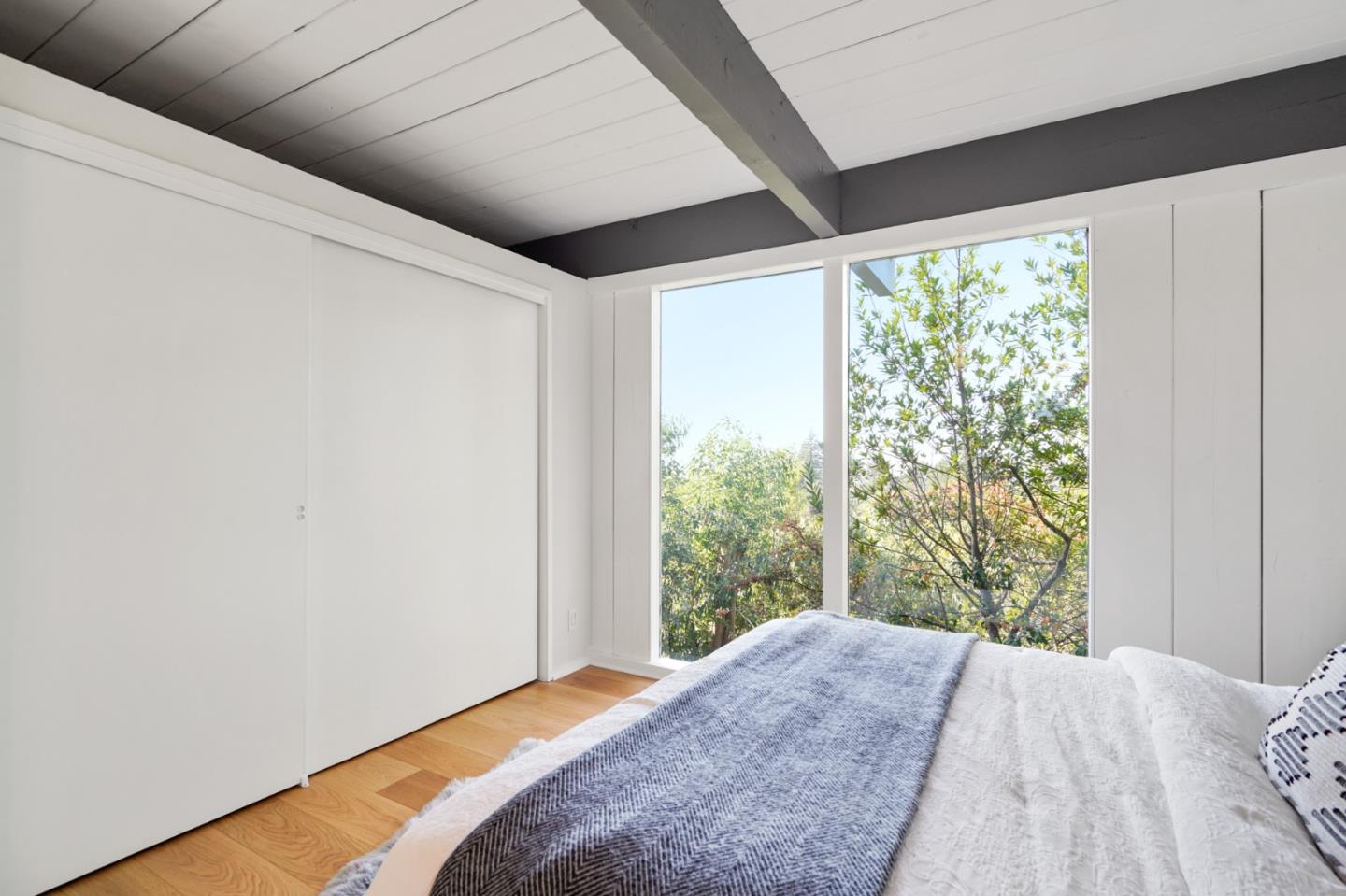 1384 Summit Road Berkeley, CA 94708 - Photo 24 of 31 a bedroom with a bed and a large window