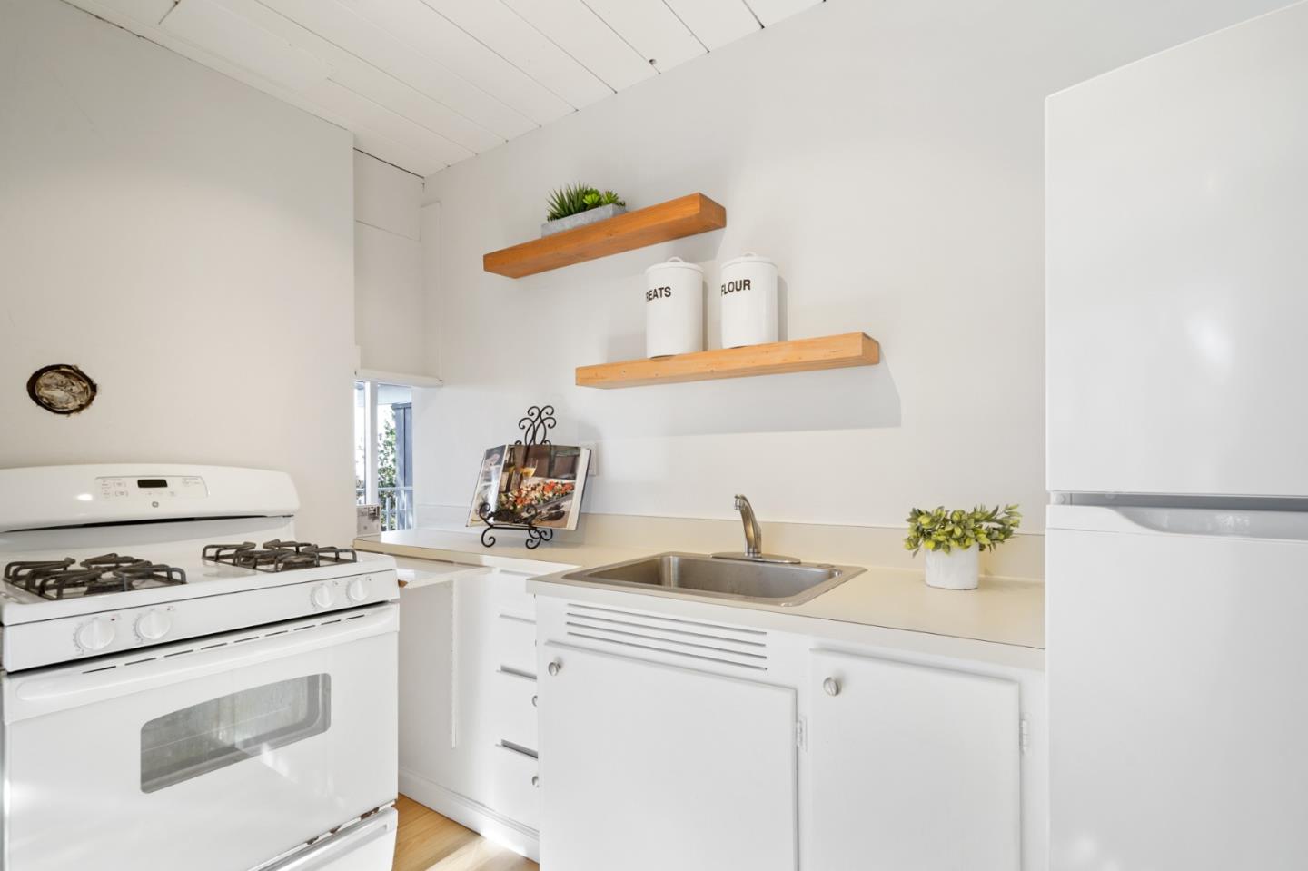 1384 Summit Road Berkeley, CA 94708 - Photo 6 of 31 a kitchen with a stove and a white cabinets