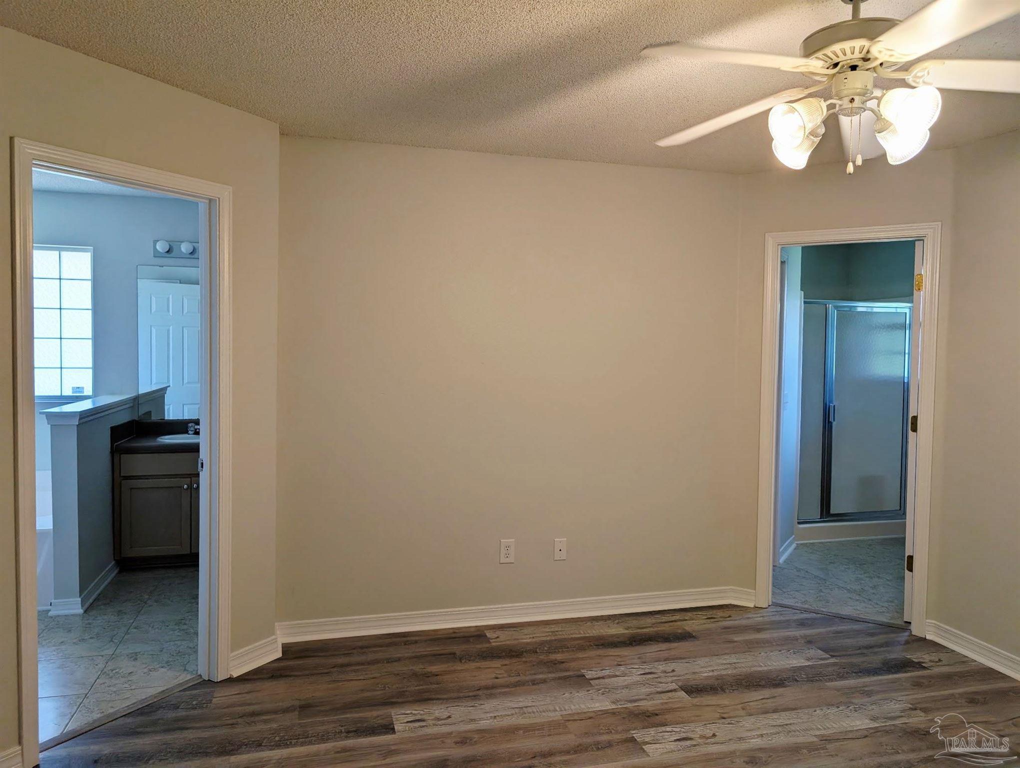 2441 Pine Forest Road Cantonment, FL 32533 - Photo 8 of 15 looking toward both master bath entrances