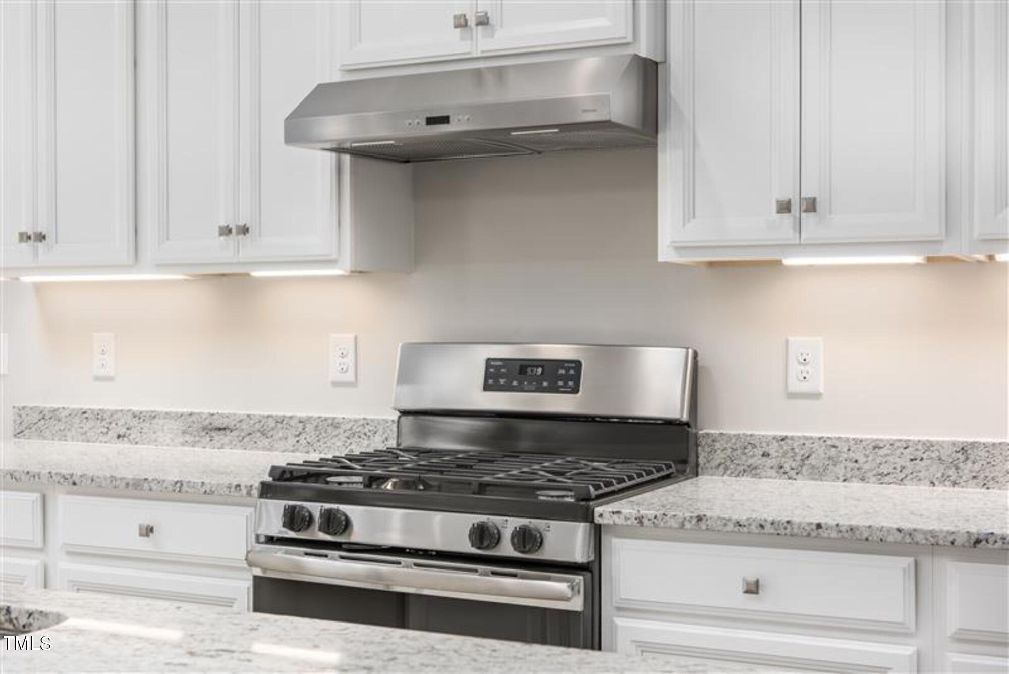 540 Impala Trace Wendell, NC 27591 - Photo 5 of 14 a stove top oven sitting inside of a kitchen