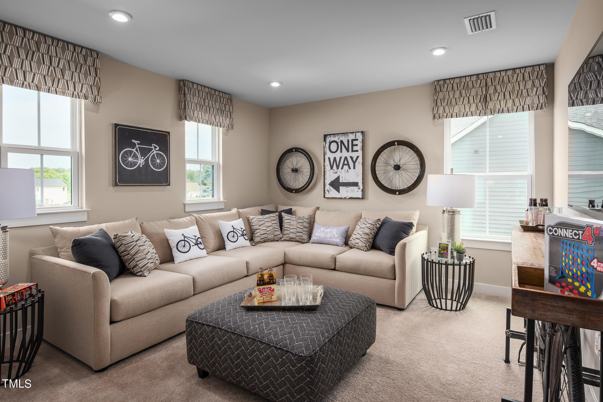 540 Impala Trace Wendell, NC 27591 - Photo 8 of 14 a living room with furniture a clock on wall and a window