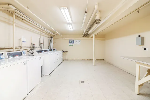 a kitchen with cabinets and white appliances