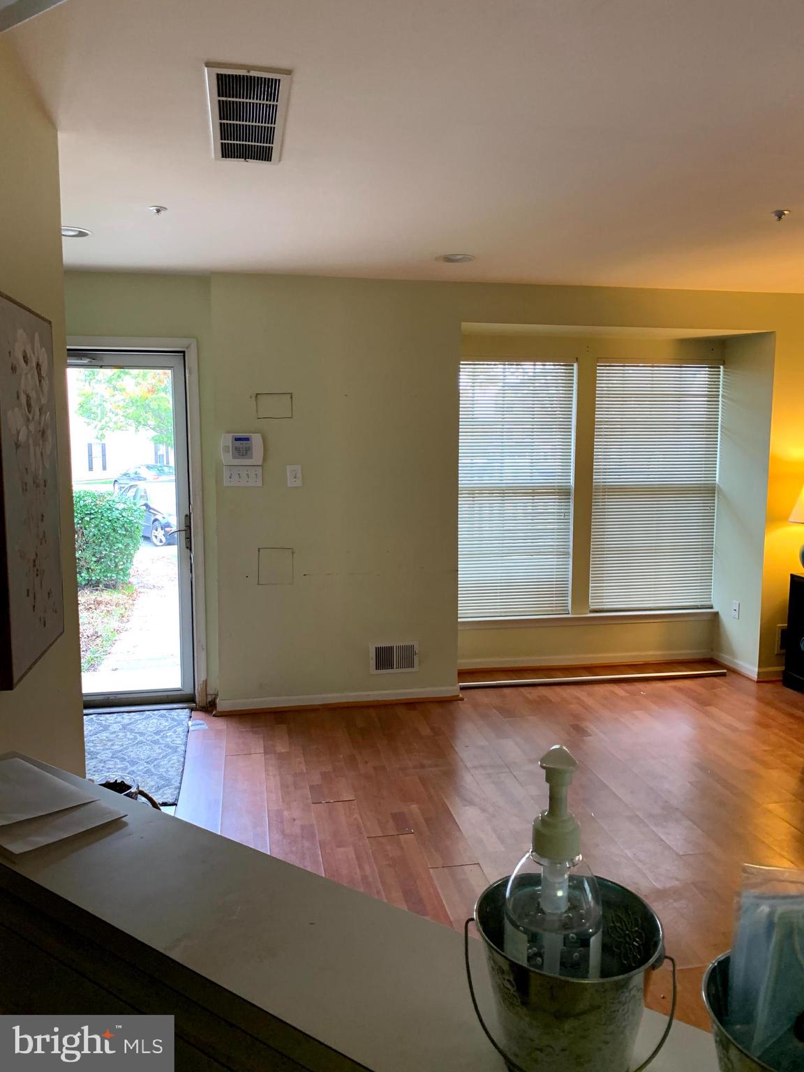 4210 Maple Path Circle, Unit 29 Baltimore, MD 21236 - Photo 9 of 10 a room with wooden floor and furniture