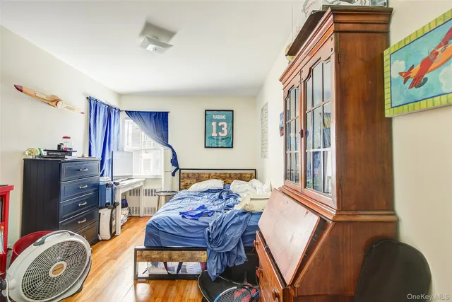 a bedroom with furniture and a book shelf