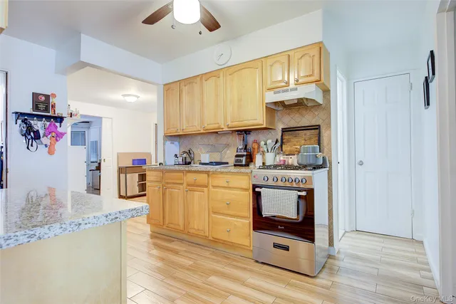 a kitchen with a refrigerator and a sink