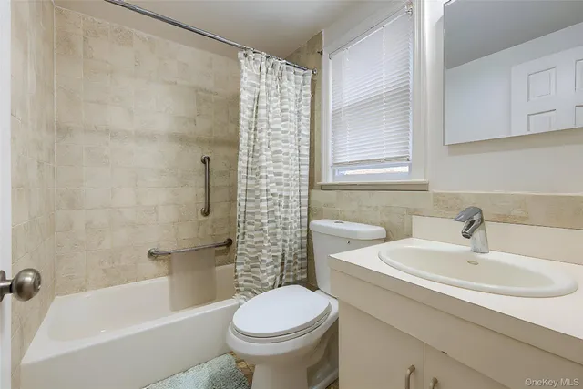 a white toilet sitting next to a bathroom sink