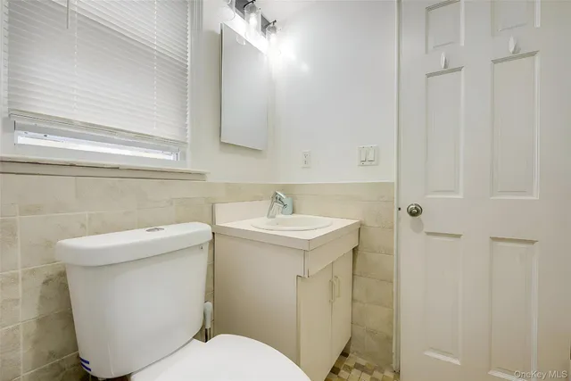 a kitchen with granite countertop a stove and wooden floor