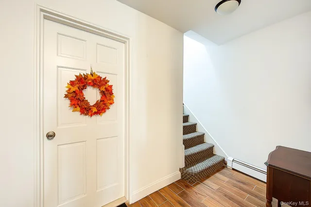a view of staircase with wooden floor