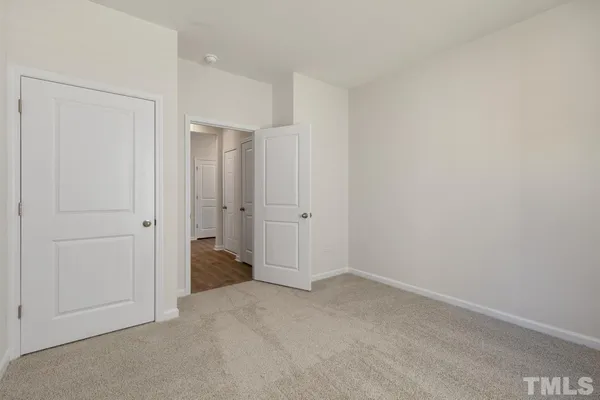 a kitchen with granite countertop stainless steel appliances a sink stove top oven and cabinets