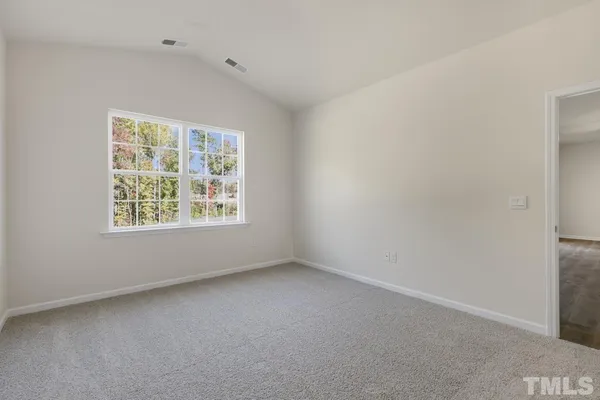 a bathroom with a shower sink and mirror
