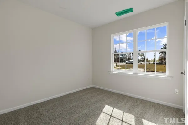 a view of a big room with windows