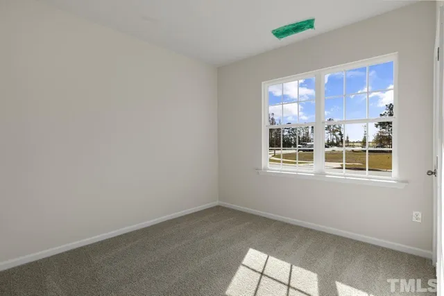 a view of a big room with windows