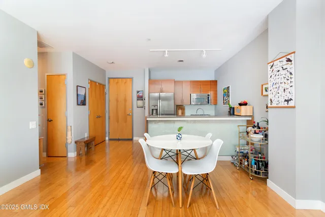 a view of a dining room with furniture and wooden floor