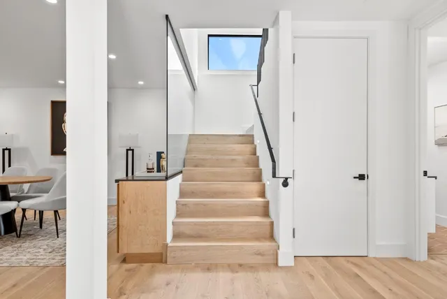 a view of entryway and hall with wooden floor