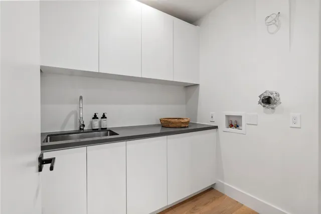 a kitchen with a sink and cabinets