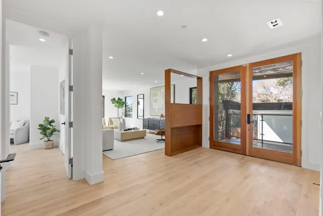 a view of a living room and a large window