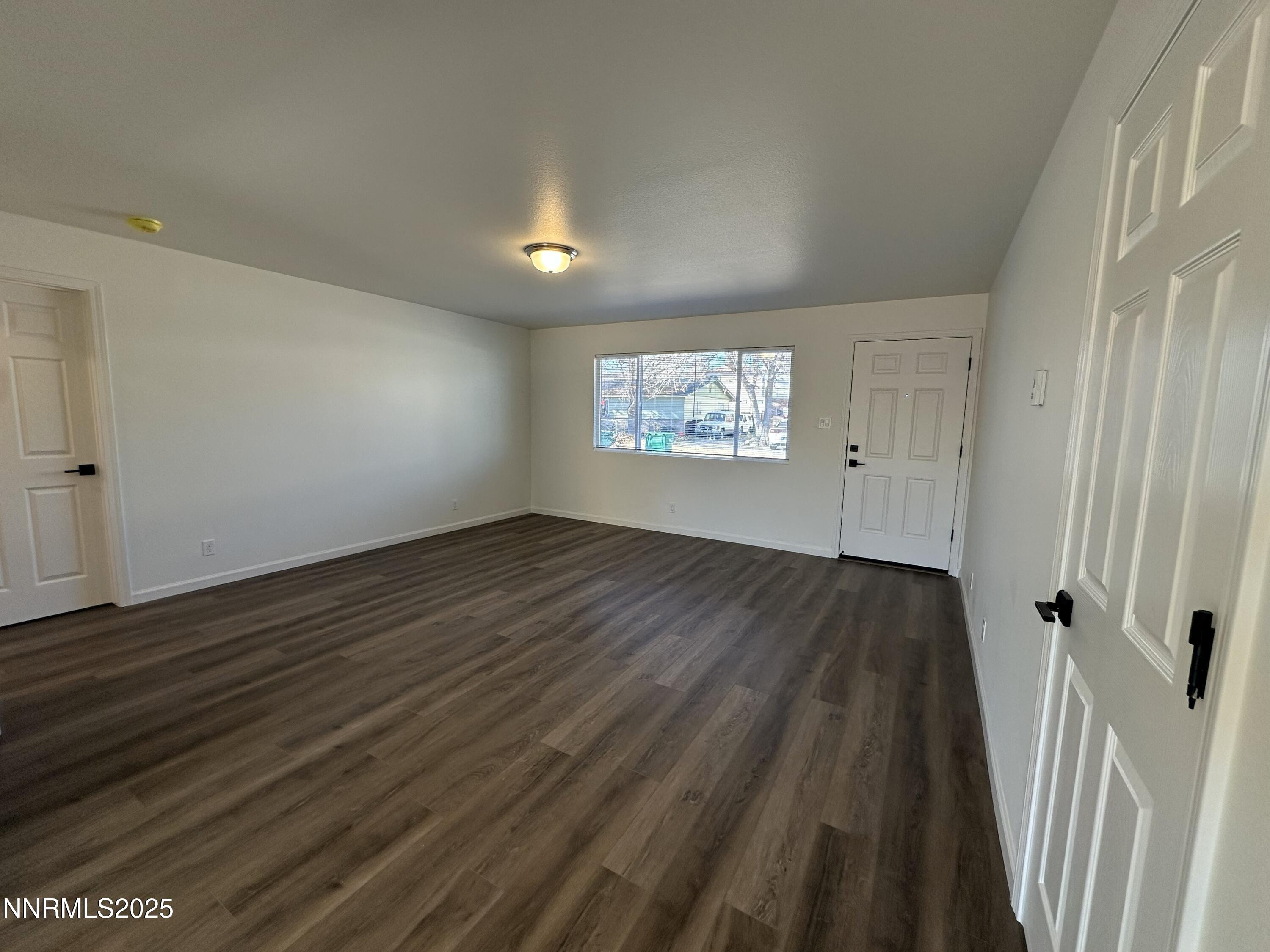 2370 Orange Lane Reno, NV 89502 - Photo 3 of 16 wooden floor in an empty room with a window