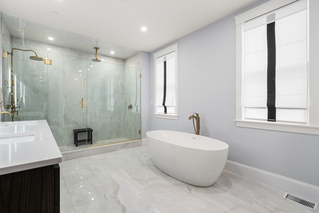 32 Pearl Street, Unit 4 Boston, MA 02125 - Photo 23 of 35 a bathroom with a bathtub and shower