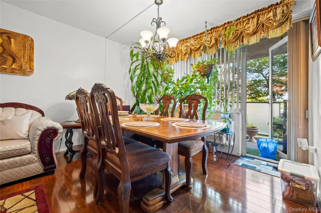 a view of a dining room with furniture and window