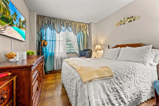 a bedroom with a bed and a dresser