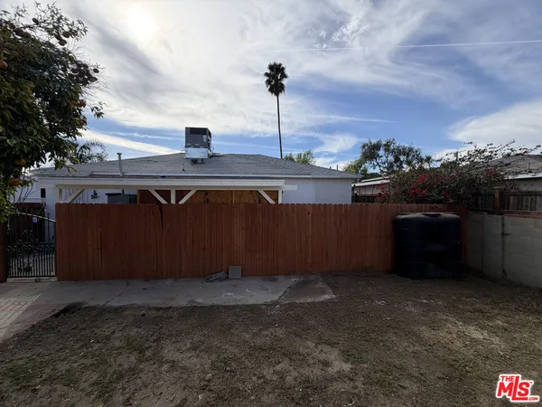 a front view of a house with outdoor seating