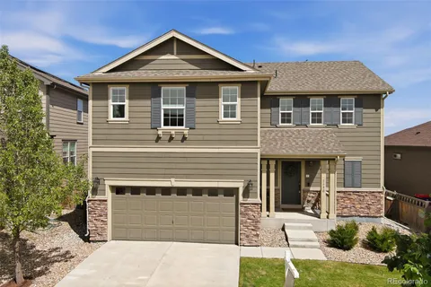 a front view of a house with a garage