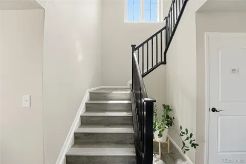 a view of entryway with wooden floor