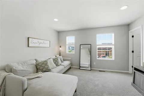 a living room with furniture and a couch