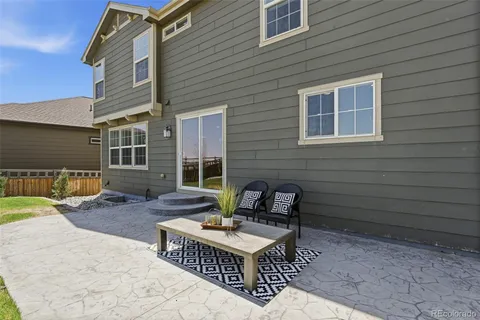 a view of a deck with a table and chairs