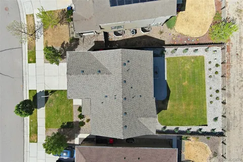 an aerial view of residential houses with outdoor space
