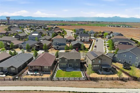 an aerial view of residential building and ocean