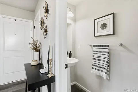 a view of hallway with furniture and a potted plant