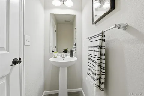 a bathroom with a sink and mirror