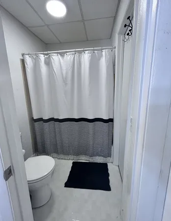 a bathroom with a sink and a shower curtain