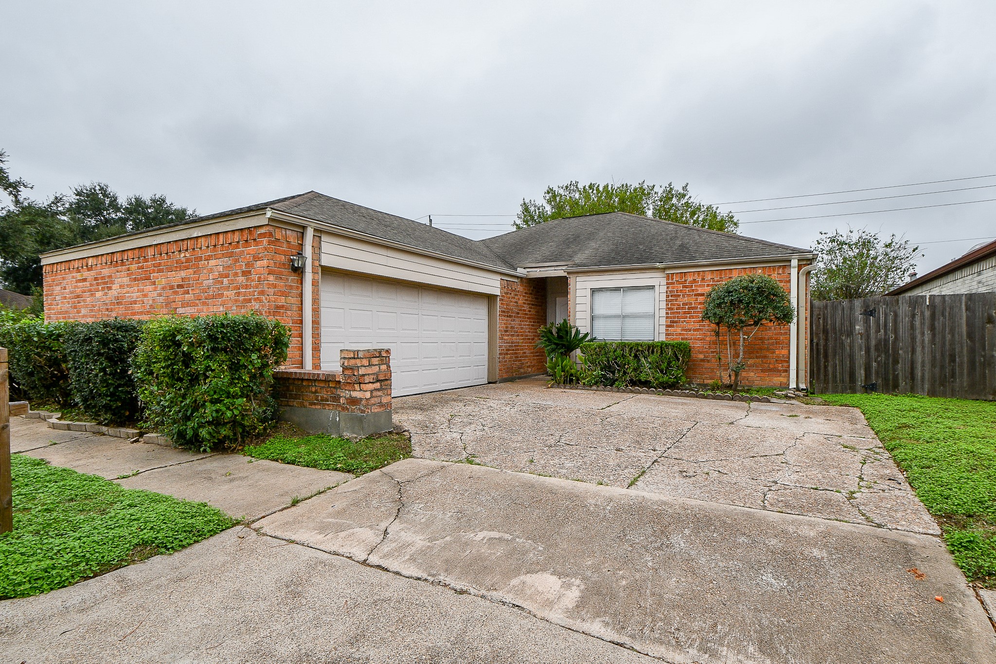 a front view of a house with a yard and a garage